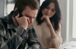 Couple looking at car insurance renewal
